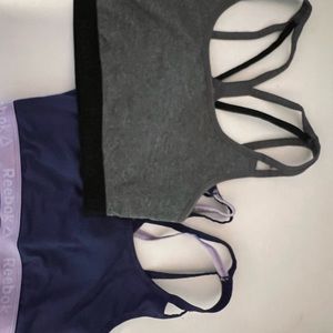 Grey and purple Reebok sports bras
